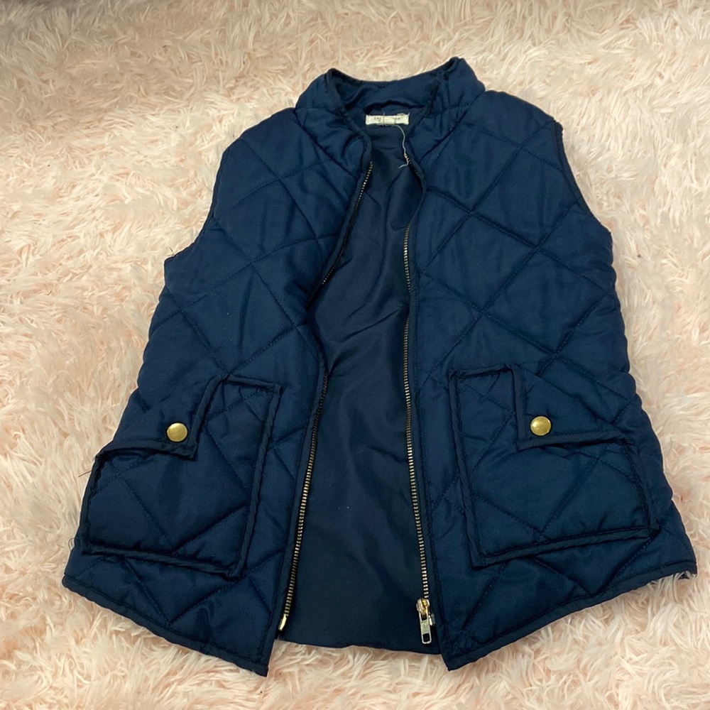 Dark blue vest never been worn still has a few tags